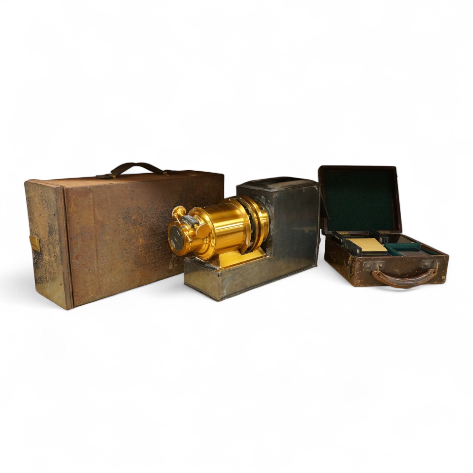 A tinplate and brass magic lantern, converted to an electric lamp and missing the original chimney, in a tin case, together with a case of slides, mostly biblical related.